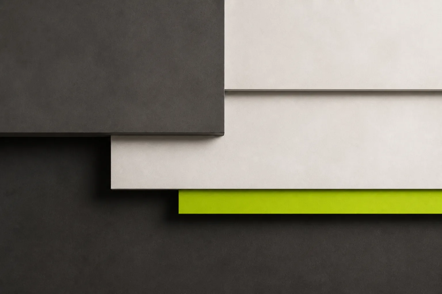 Abstract layered rectangles in charcoal and off white with an acid lime strip hinting at stacked technical layers.